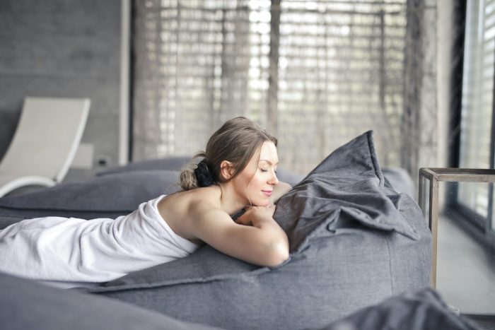 Healthy lady relaxing on couch